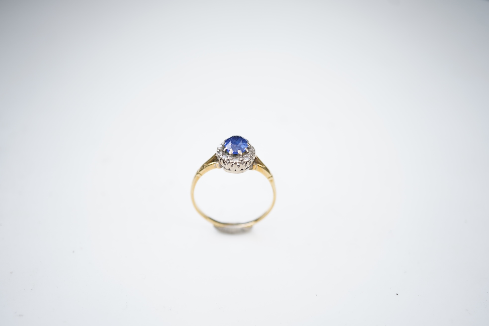 A synthetic sapphire and diamond cluster ring, mid 20th century